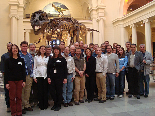 An oversize tyrranosaur photo-bombs the Global Ant Project group portrait at the Chicago Field Museum